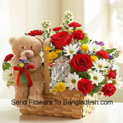 Mandje met Assortiment Bloemen en een schattige bruine teddybeer van 6 inch